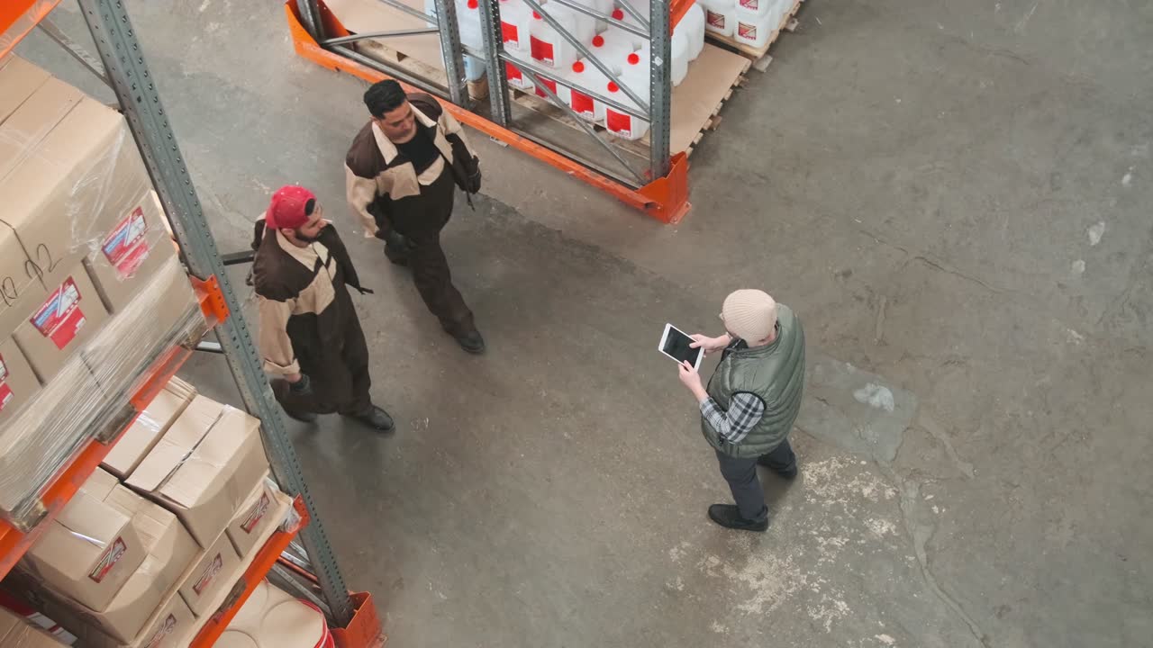 Warehouse workers seen from above