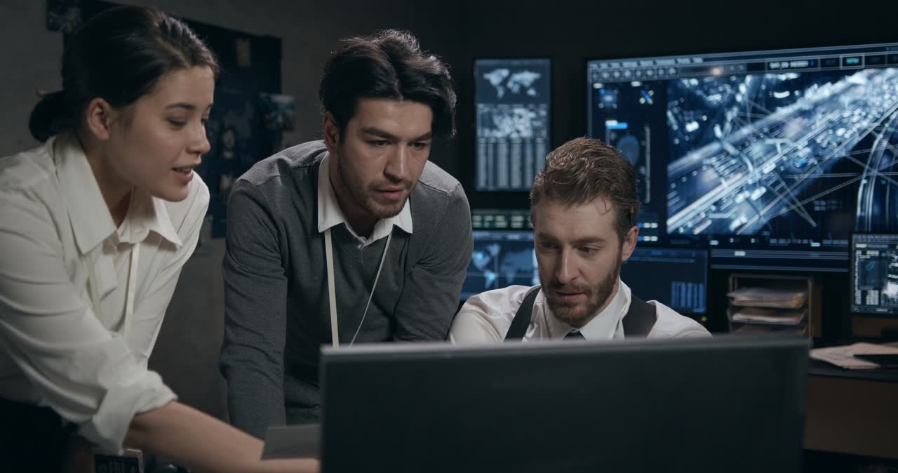 Team reviewing monitoring screens