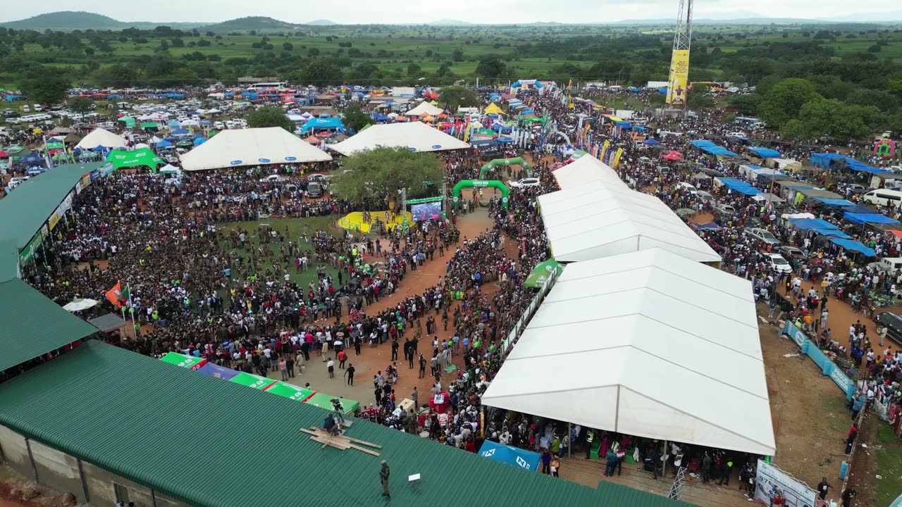 Aerial view of a festival with tents and crowds
