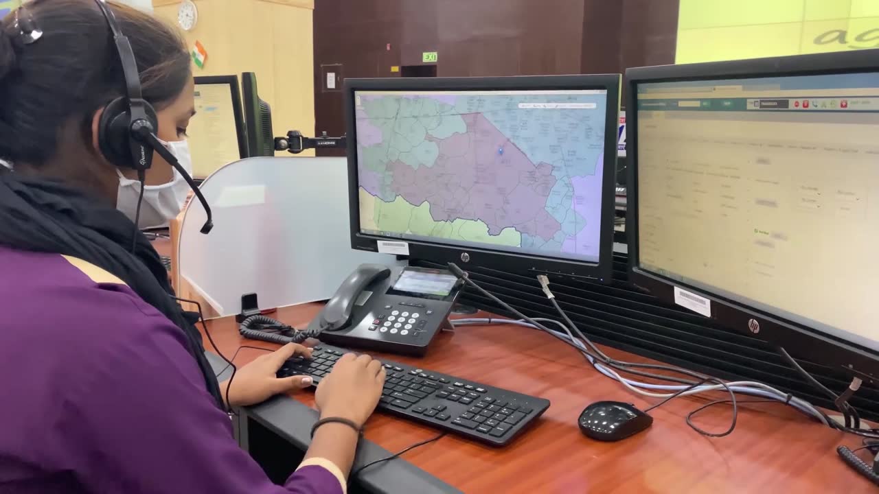 Dispatcher with a headset at a computer
